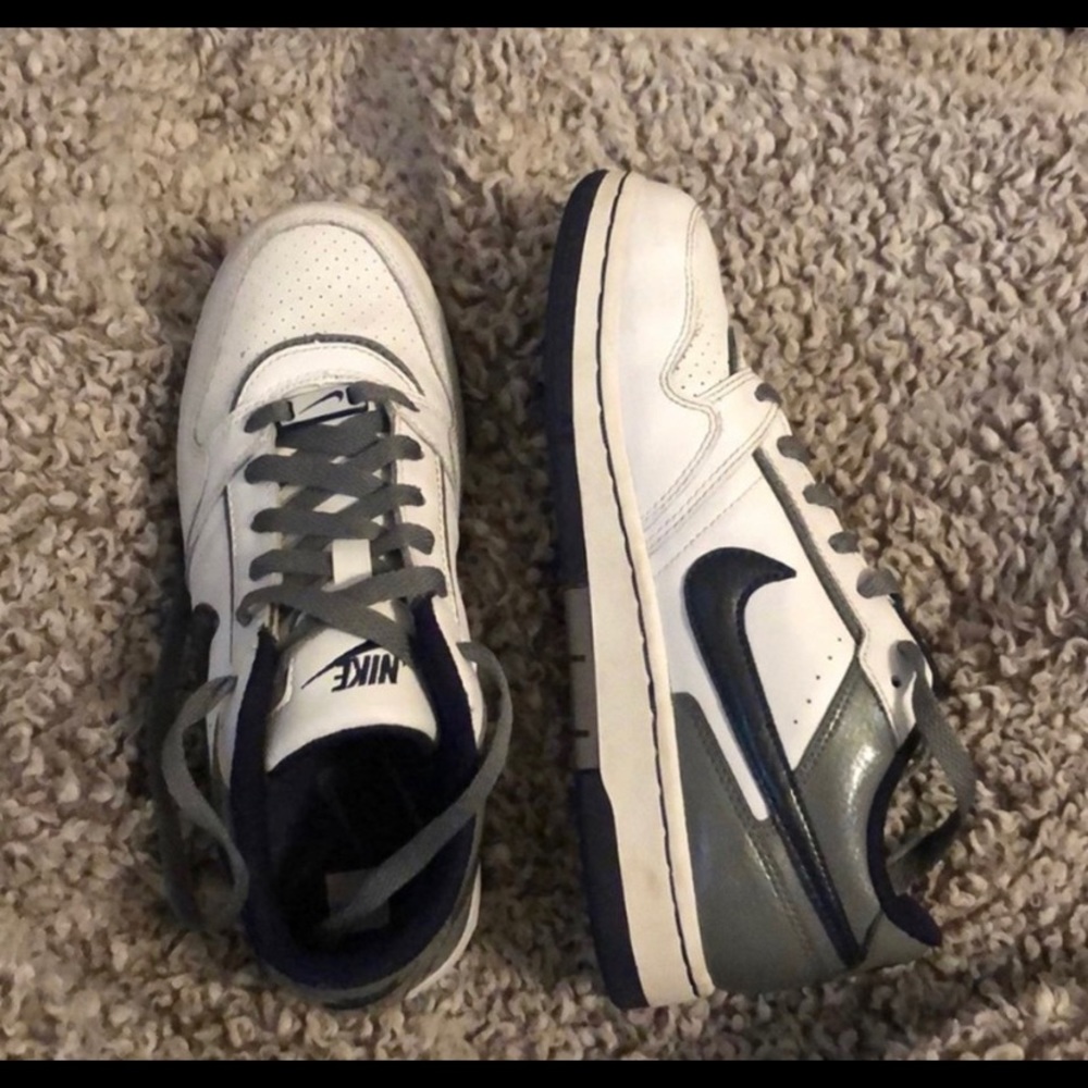 White, navy and gray Nike courts
